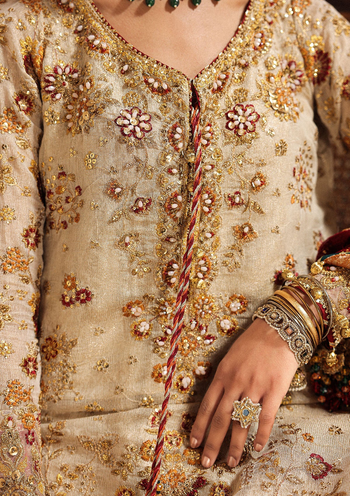 Elegant off white zari net dress with embellished embroidery, organza borders and sleeves. Paired with jamawar pants and chiffon dupatta.
