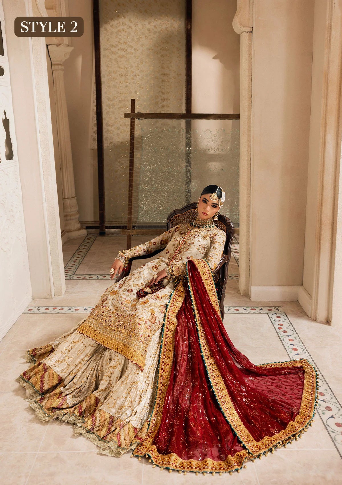 Elegant off white zari net dress with embellished embroidery, organza borders and sleeves. Paired with jamawar pants and chiffon dupatta.