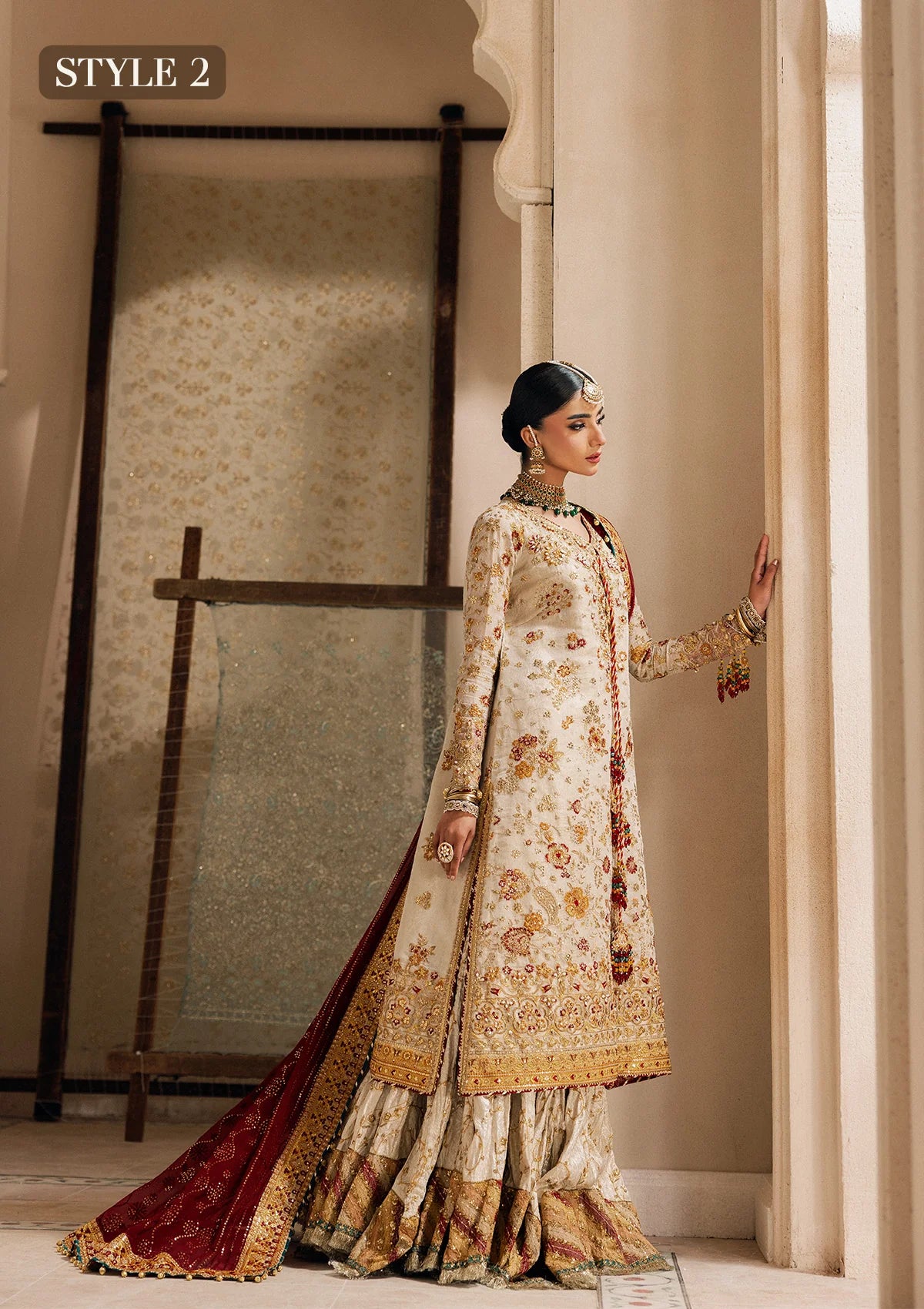 Elegant off white zari net dress with embellished embroidery, organza borders and sleeves. Paired with jamawar pants and chiffon dupatta.