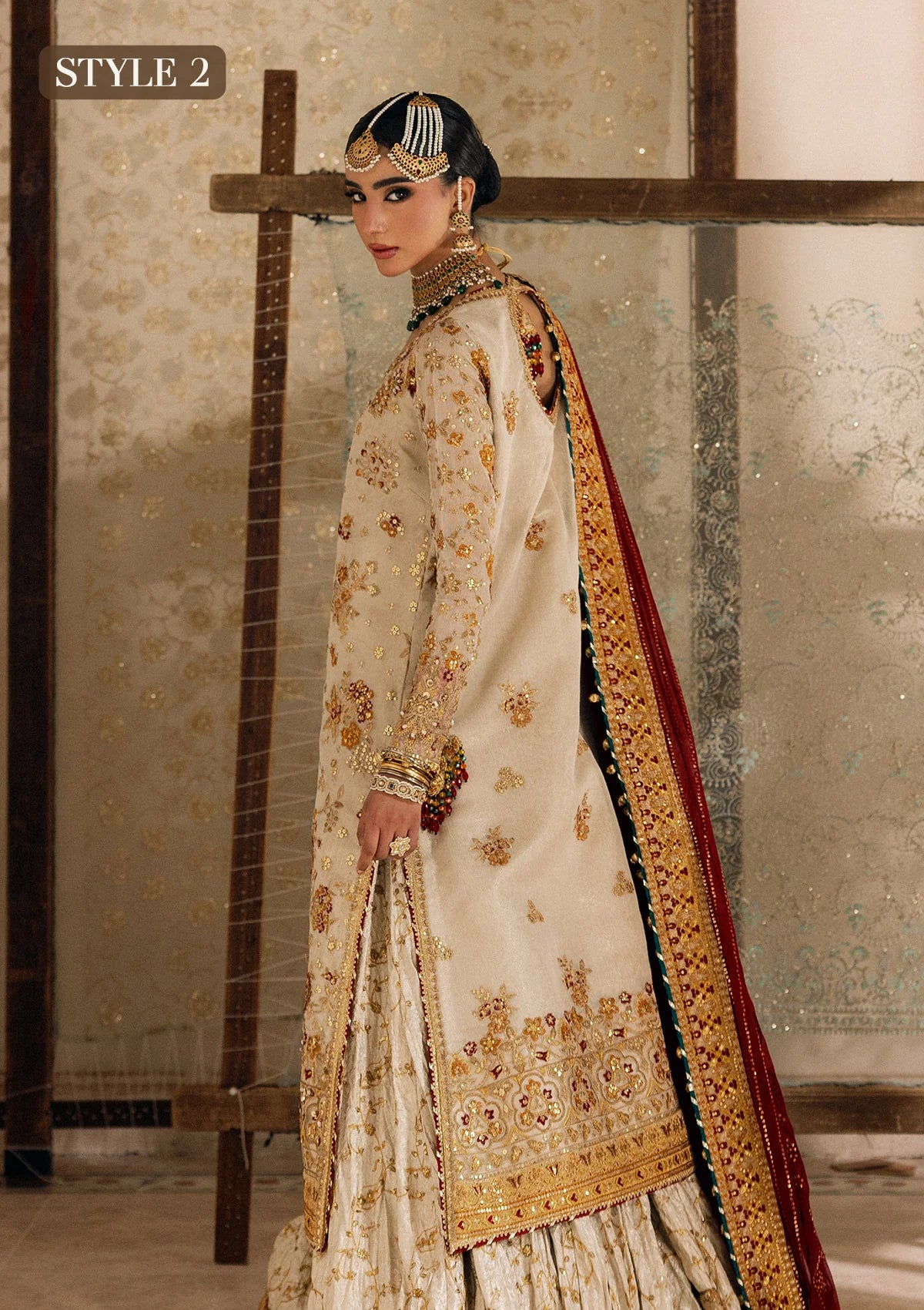 Elegant off white zari net dress with embellished embroidery, organza borders and sleeves. Paired with jamawar pants and chiffon dupatta.