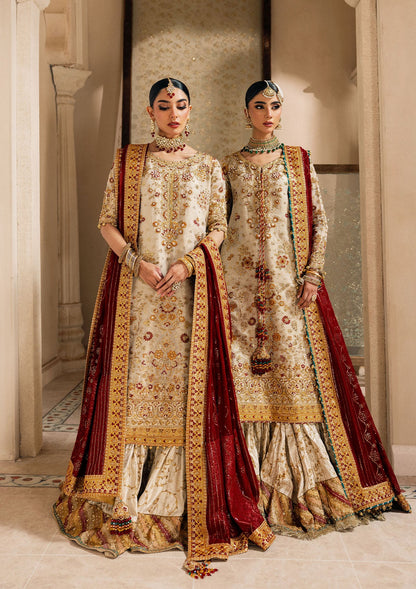 Elegant off white zari net dress with embellished embroidery, organza borders and sleeves. Paired with jamawar pants and chiffon dupatta.