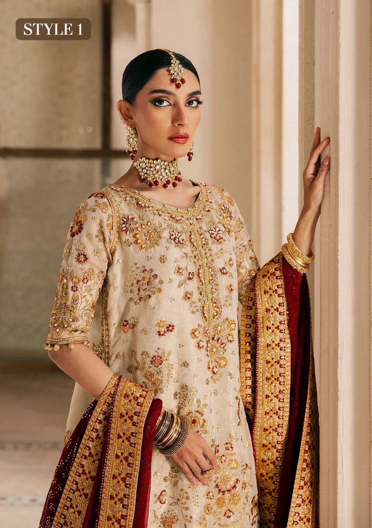 Elegant off white zari net dress with embellished embroidery, organza borders and sleeves. Paired with jamawar pants and chiffon dupatta.
