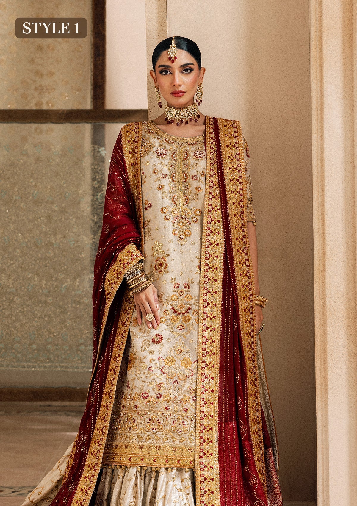 Elegant off white zari net dress with embellished embroidery, organza borders and sleeves. Paired with jamawar pants and chiffon dupatta.