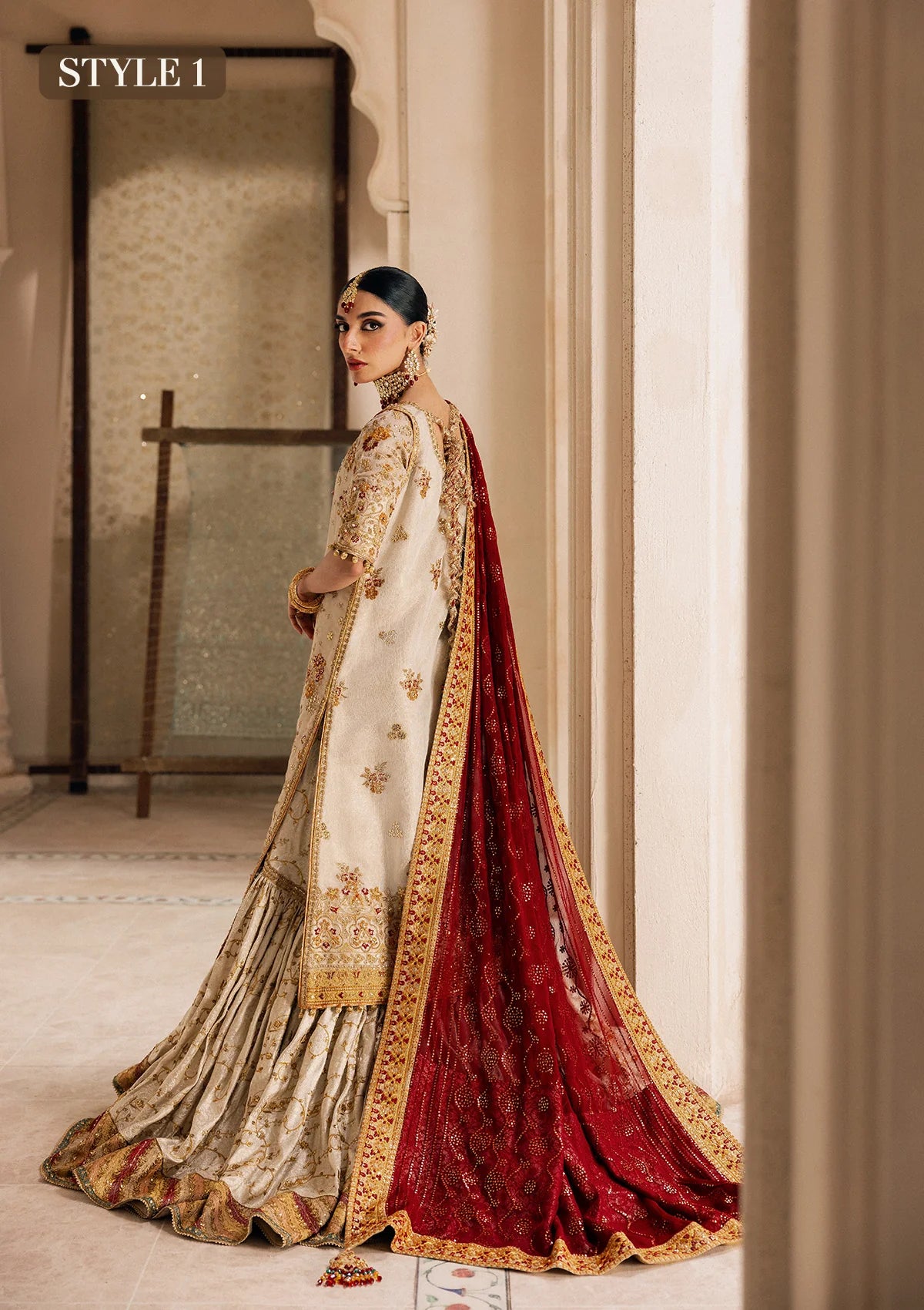 Elegant off white zari net dress with embellished embroidery, organza borders and sleeves. Paired with jamawar pants and chiffon dupatta.
