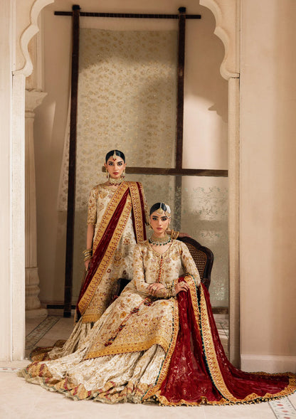 Elegant off white zari net dress with embellished embroidery, organza borders and sleeves. Paired with jamawar pants and chiffon dupatta.