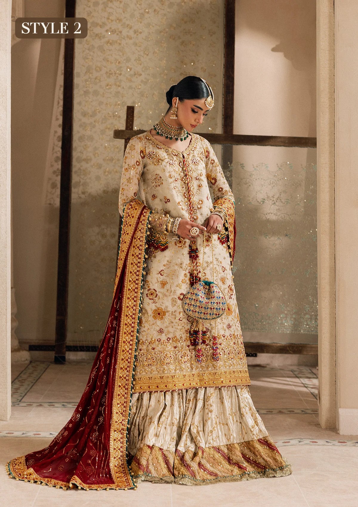 Elegant off white zari net dress with embellished embroidery, organza borders and sleeves. Paired with jamawar pants and chiffon dupatta.