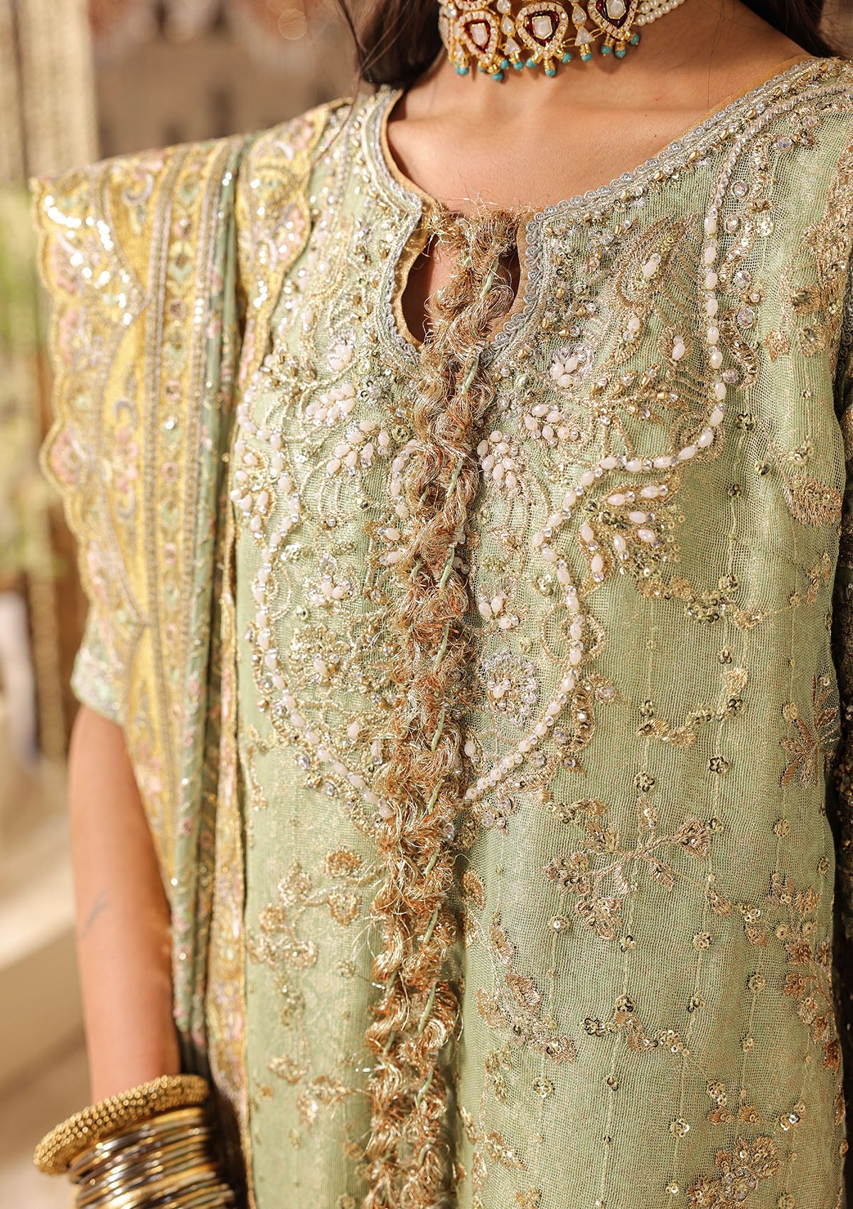 Shop mint green zari net embroidered dress with jamawar pants & chiffon dupatta. Features sharara & Hyderabadi gharara styles—perfect festive wear.