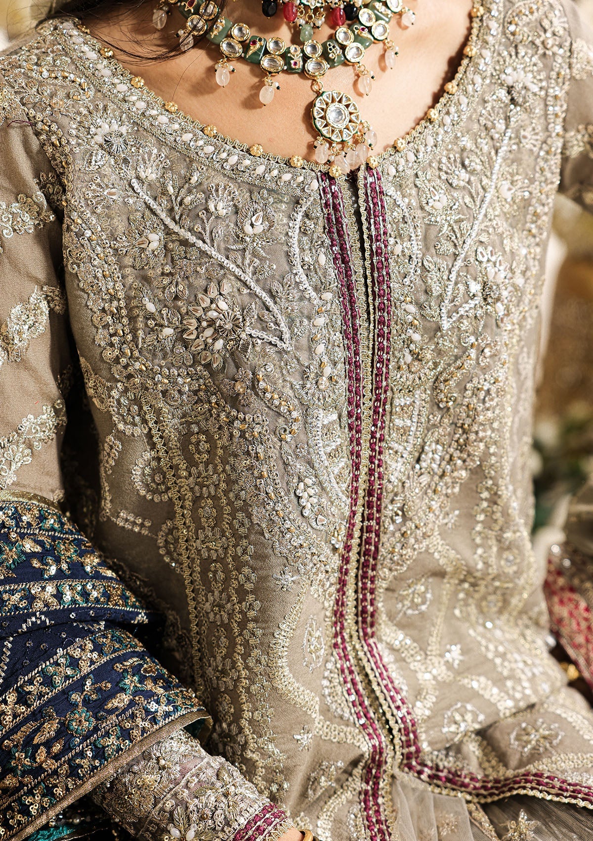 Shop grey khaadi net embroidered dress with masoori pants & chiffon dupatta. Features long shirt with gharara or open front skirt style—perfect festive wear.