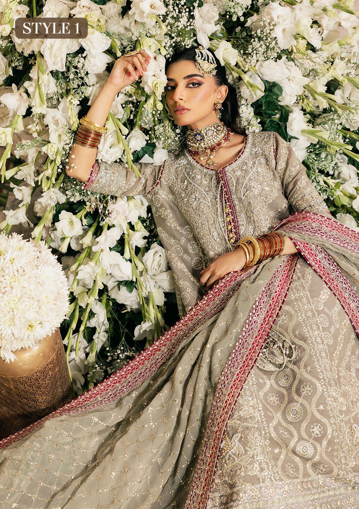 Shop grey khaadi net embroidered dress with masoori pants & chiffon dupatta. Features long shirt with gharara or open front skirt style—perfect festive wear.
