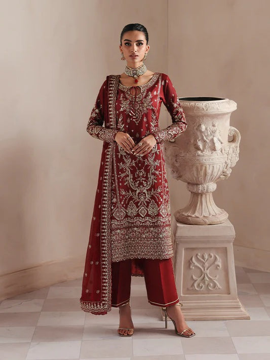 Elegant raw silk dress featuring intricate embroidered and sequined panels, borders, and chiffon dupatta. Includes organza accents and dyed silk trouser.