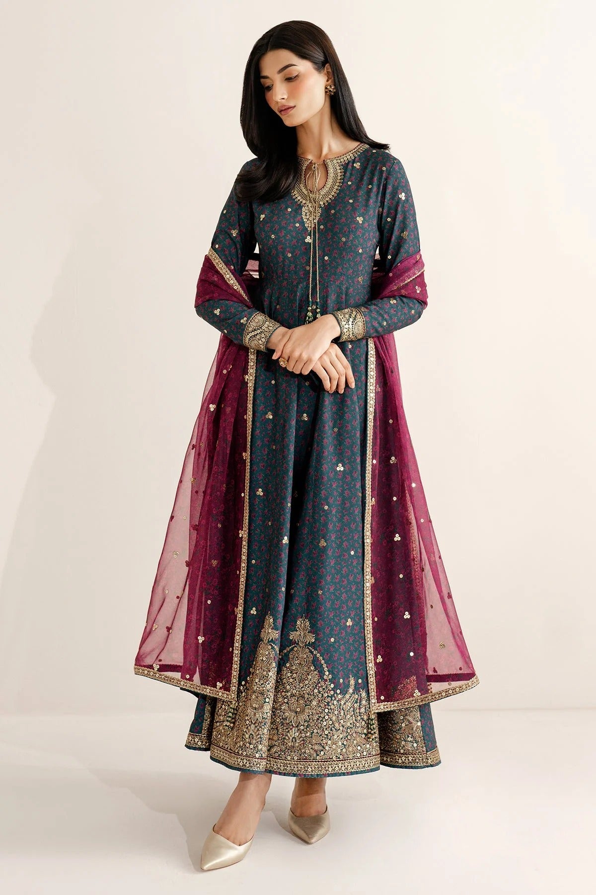 Discover UR-7058: a premium embroidered raw silk suit with chiffon dupatta and elegant borders. Perfect for formal, festive, or party occasions. Shop now!