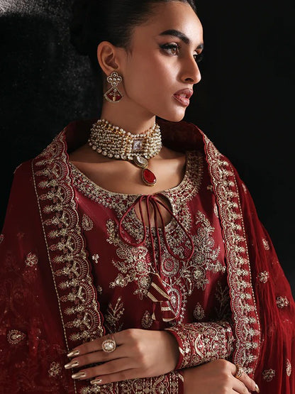 Elegant raw silk dress featuring intricate embroidered and sequined panels, borders, and chiffon dupatta. Includes organza accents and dyed silk trouser.