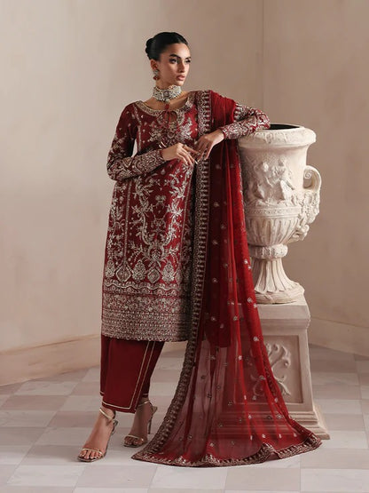 Elegant raw silk dress featuring intricate embroidered and sequined panels, borders, and chiffon dupatta. Includes organza accents and dyed silk trouser.
