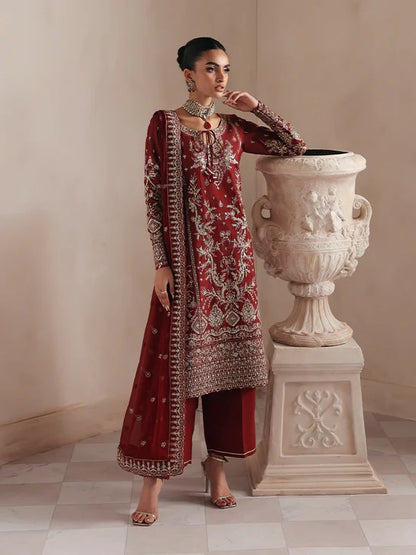 Elegant raw silk dress featuring intricate embroidered and sequined panels, borders, and chiffon dupatta. Includes organza accents and dyed silk trouser.