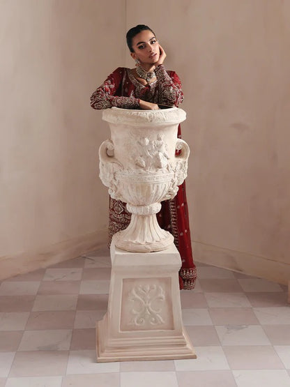 Elegant raw silk dress featuring intricate embroidered and sequined panels, borders, and chiffon dupatta. Includes organza accents and dyed silk trouser.