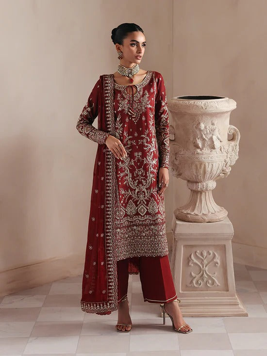 Elegant raw silk dress featuring intricate embroidered and sequined panels, borders, and chiffon dupatta. Includes organza accents and dyed silk trouser.