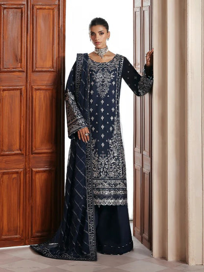 Stunning raw silk sharara dress with hand-embroidered and sequined panels, chiffon dupatta, and organza borders—crafted for luxury festive and bridal wear.