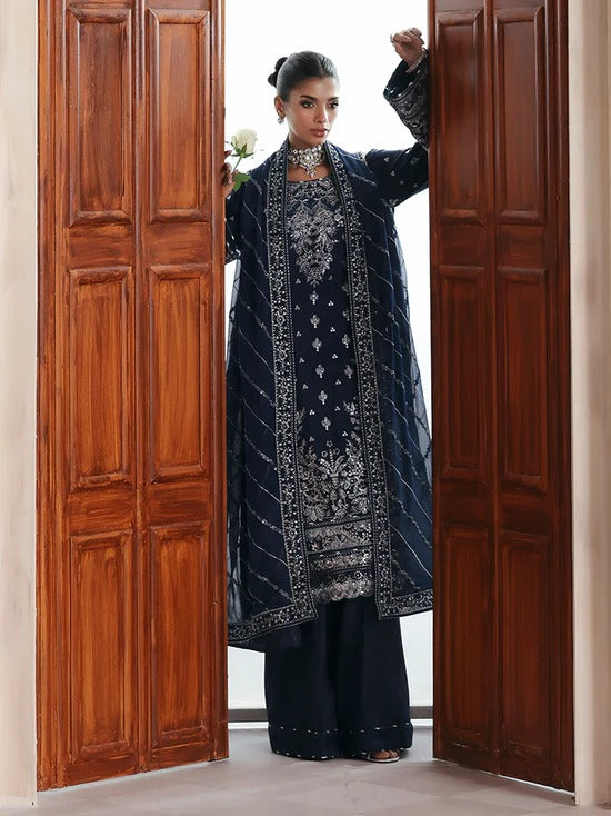 Stunning raw silk sharara dress with hand-embroidered and sequined panels, chiffon dupatta, and organza borders—crafted for luxury festive and bridal wear.