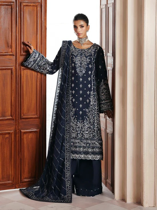Stunning raw silk sharara dress with hand-embroidered and sequined panels, chiffon dupatta, and organza borders—crafted for luxury festive and bridal wear.