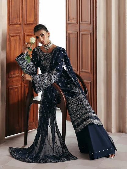 Stunning raw silk sharara dress with hand-embroidered and sequined panels, chiffon dupatta, and organza borders—crafted for luxury festive and bridal wear.
