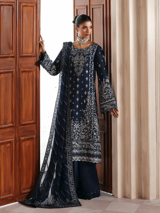 Stunning raw silk sharara dress with hand-embroidered and sequined panels, chiffon dupatta, and organza borders—crafted for luxury festive and bridal wear.