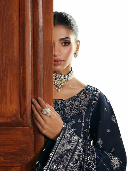 Stunning raw silk sharara dress with hand-embroidered and sequined panels, chiffon dupatta, and organza borders—crafted for luxury festive and bridal wear.