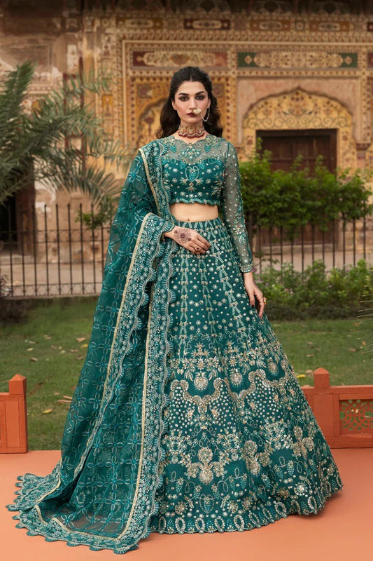 Elegant organza suit with embellished panels, blouse, sleeves & dupatta, paired with inner—crafted for timeless beauty, sophistication & luxury.