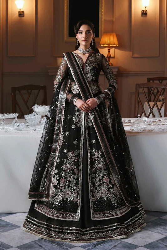 Stunning organza lehenga with embroidered panels, blouse, sleeves, dupatta & borders, paired with raw silk inner—crafted for regal elegance & style.