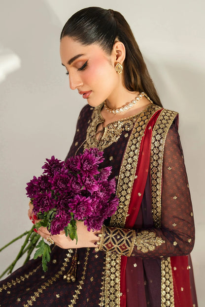 Intricately embroidered chiffon suit with digital prints, bordered dupatta, and raw silk bottom—crafted for timeless elegance and formal sophistication.