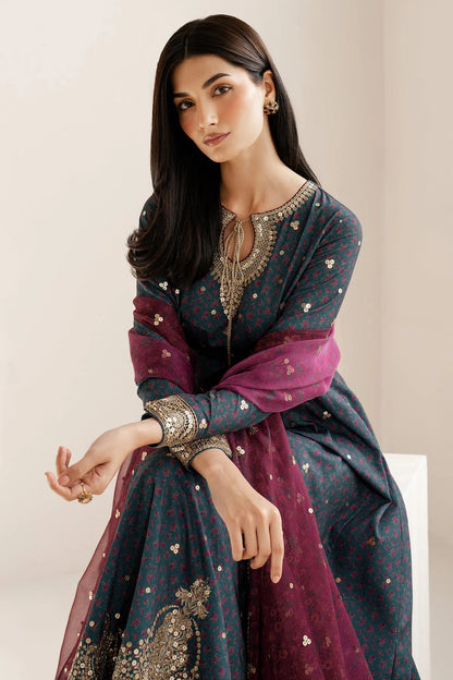 Discover UR-7058: a premium embroidered raw silk suit with chiffon dupatta and elegant borders. Perfect for formal, festive, or party occasions. Shop now!