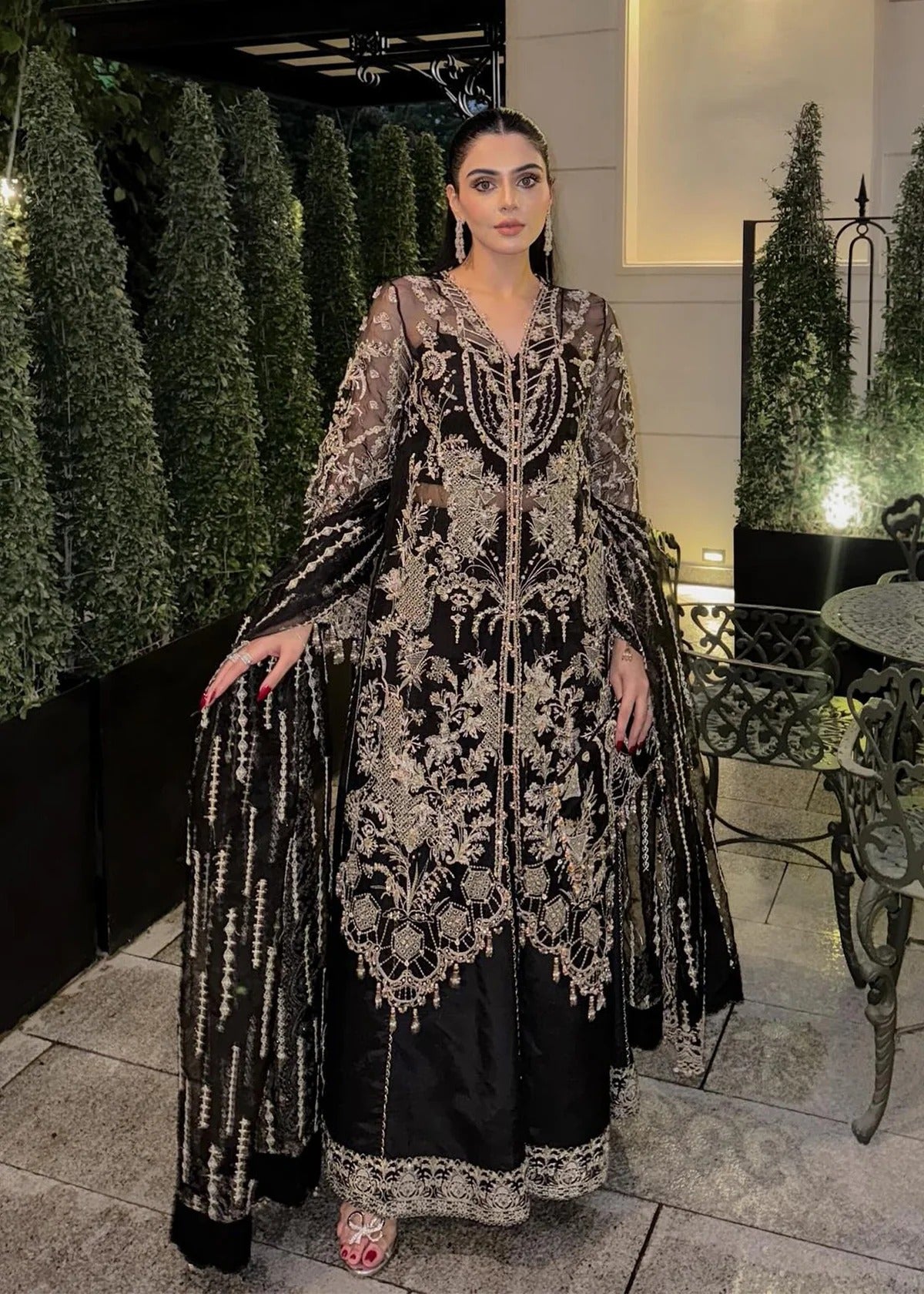 Majestic onyx noir suit with hand-embellished organza panels, refined borders, embroidered dupatta, and sleek trouser for timeless evening elegance.