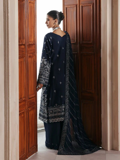 Stunning raw silk sharara dress with hand-embroidered and sequined panels, chiffon dupatta, and organza borders—crafted for luxury festive and bridal wear.