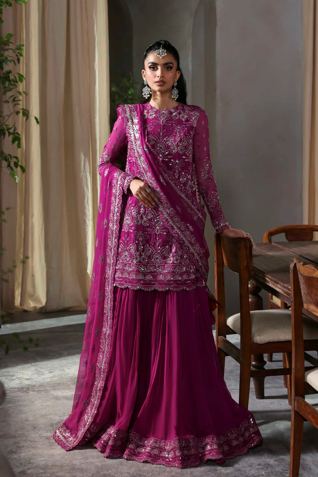 Elegant chiffon outfit featuring embroidered front, back, and sleeves with a chiffon dupatta and organza garara border. Perfect for festive and formal occasions.
