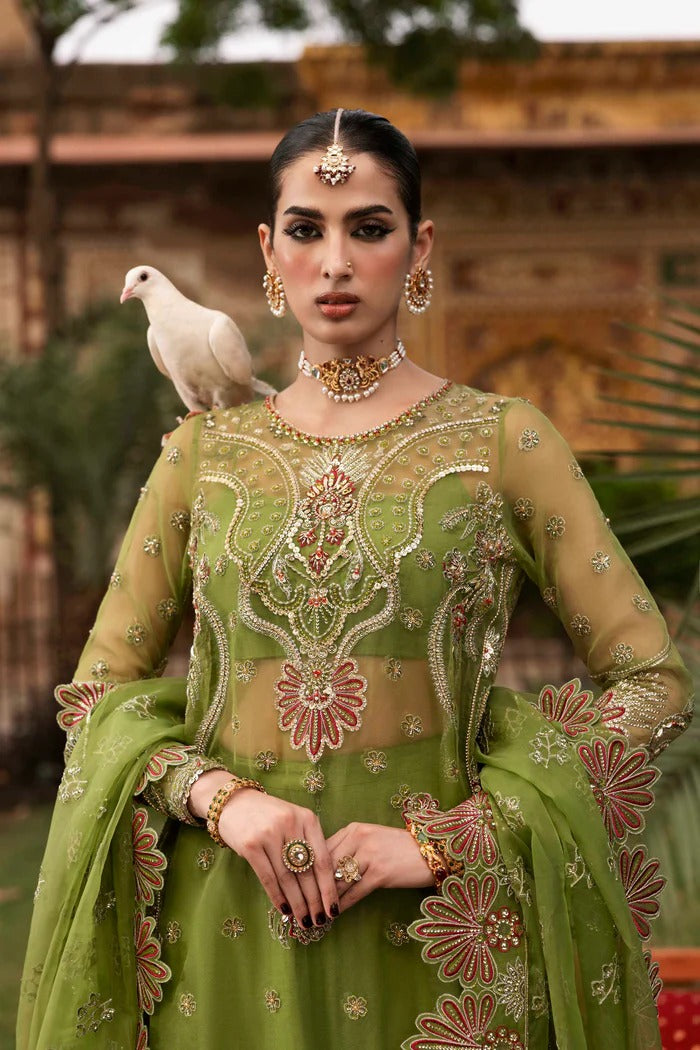 Premium organza suit with hand-embellished front, borders, dupatta, sleeves & raw silk trouser—crafted for elegance, style, and timeless charm.