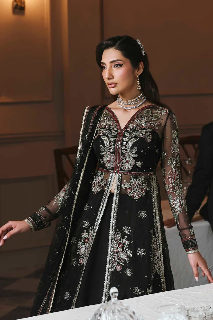 Stunning organza lehenga with embroidered panels, blouse, sleeves, dupatta & borders, paired with raw silk inner—crafted for regal elegance & style.