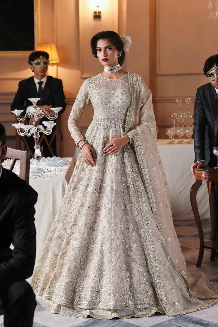 Chic organza dress featuring embroidered panels, blouse, sleeves & dupatta, paired with raw silk inner—crafted for timeless elegance and style.