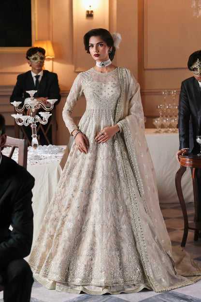Chic organza dress featuring embroidered panels, blouse, sleeves & dupatta, paired with raw silk inner—crafted for timeless elegance and style.