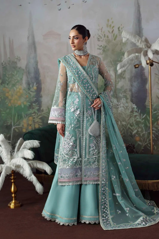 Chic net & organza suit with embroidered panels, sleeves, dupatta & borders, paired with silk inner and trouser—crafted for elegance & timeless style.