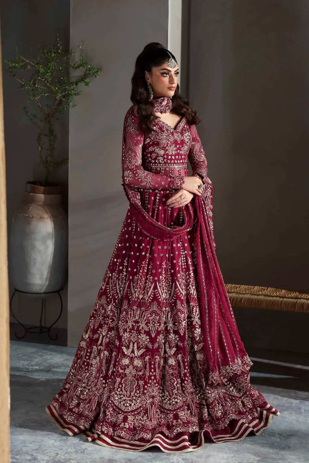Graceful chiffon dress featuring 12" embroidered panels, elegant sleeves, and organza borders, paired with a matching dupatta and soft raw silk inner.