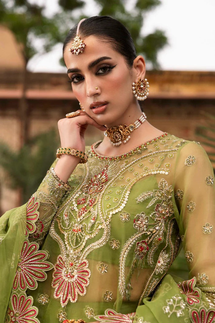 Premium organza suit with hand-embellished front, borders, dupatta, sleeves & raw silk trouser—crafted for elegance, style, and timeless charm.