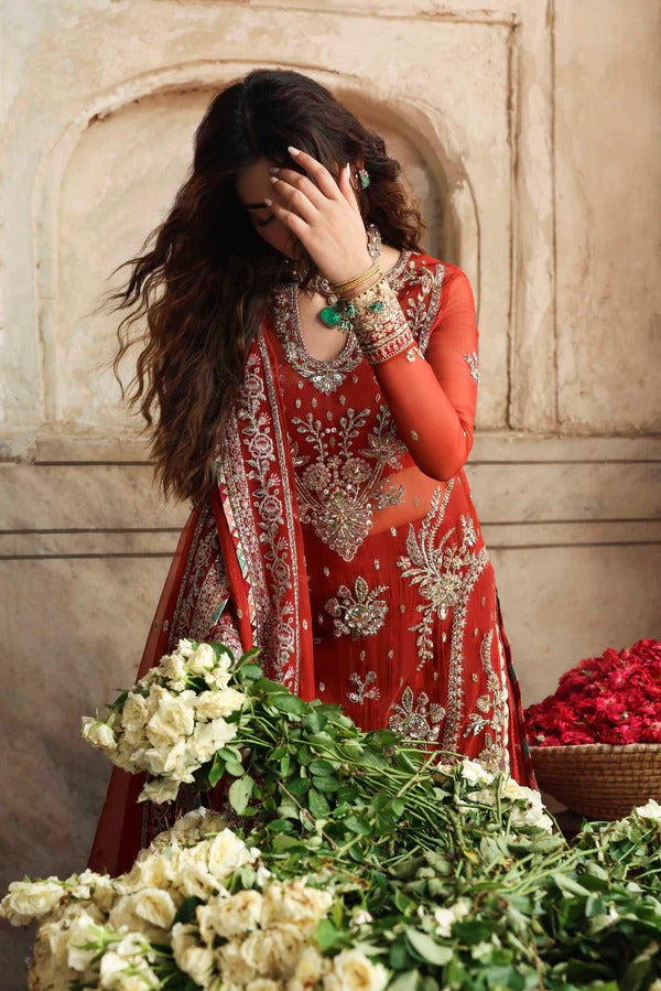 Elegant organza formal dress with detailed embroidery and hand embellishment, paired with raw silk trouser for a refined festive look.