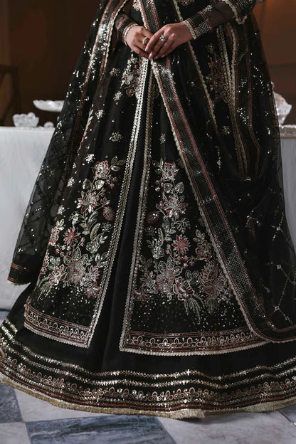 Stunning organza lehenga with embroidered panels, blouse, sleeves, dupatta & borders, paired with raw silk inner—crafted for regal elegance & style.