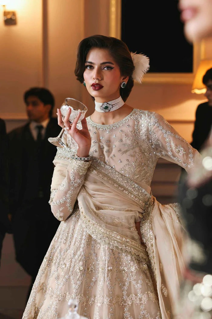 Chic organza dress featuring embroidered panels, blouse, sleeves & dupatta, paired with raw silk inner—crafted for timeless elegance and style.