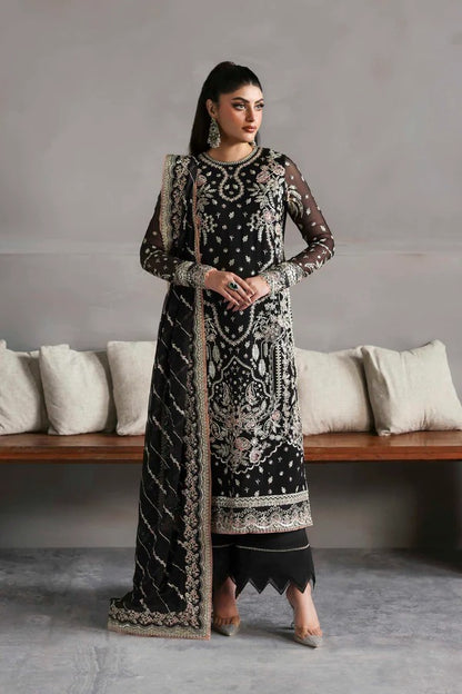 Elegant chiffon dress with embroidered front, back, and sleeves, paired with an organza dupatta and raw silk trouser — perfect for formal elegance.