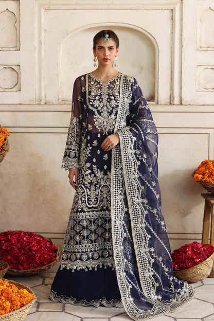 A luxurious organza outfit featuring hand-embellished front, sleeves, and borders. Comes with an embroidered dupatta and raw silk trouser for a graceful formal look.