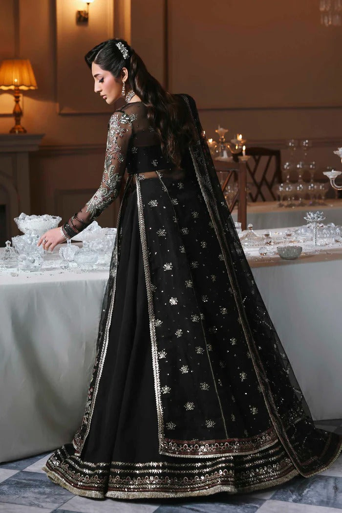Stunning organza lehenga with embroidered panels, blouse, sleeves, dupatta & borders, paired with raw silk inner—crafted for regal elegance & style.