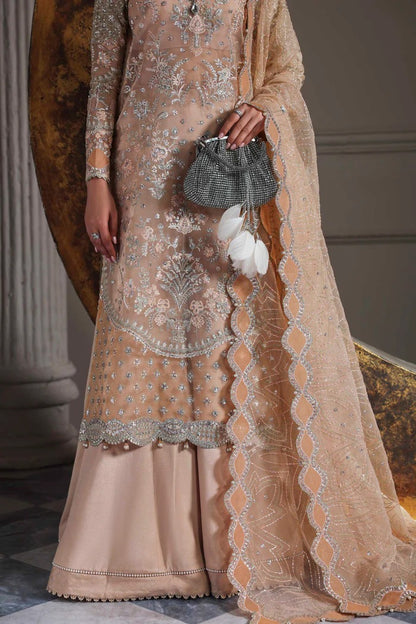 Elegant organza suit featuring embroidered front, back, sleeves, dupatta & trouser with borders, paired with silk inner—crafted for timeless grace.