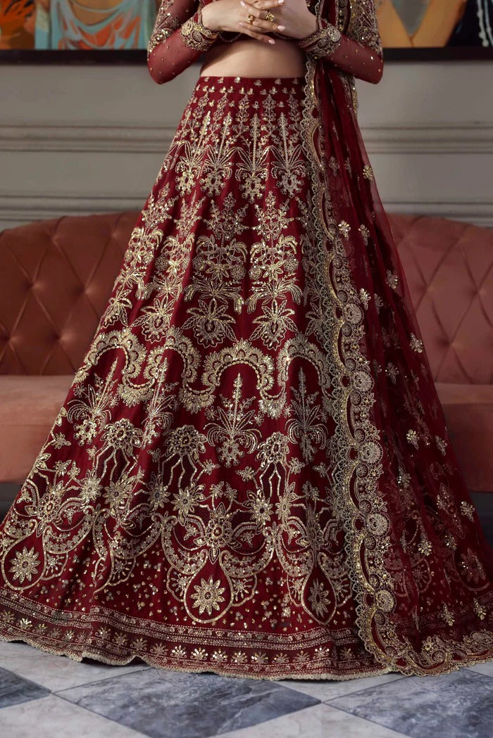 Elegant net dress featuring embroidered panels, blouse, neckline, sleeves & dupatta with borders, paired with silk inner—crafted for timeless grace.
