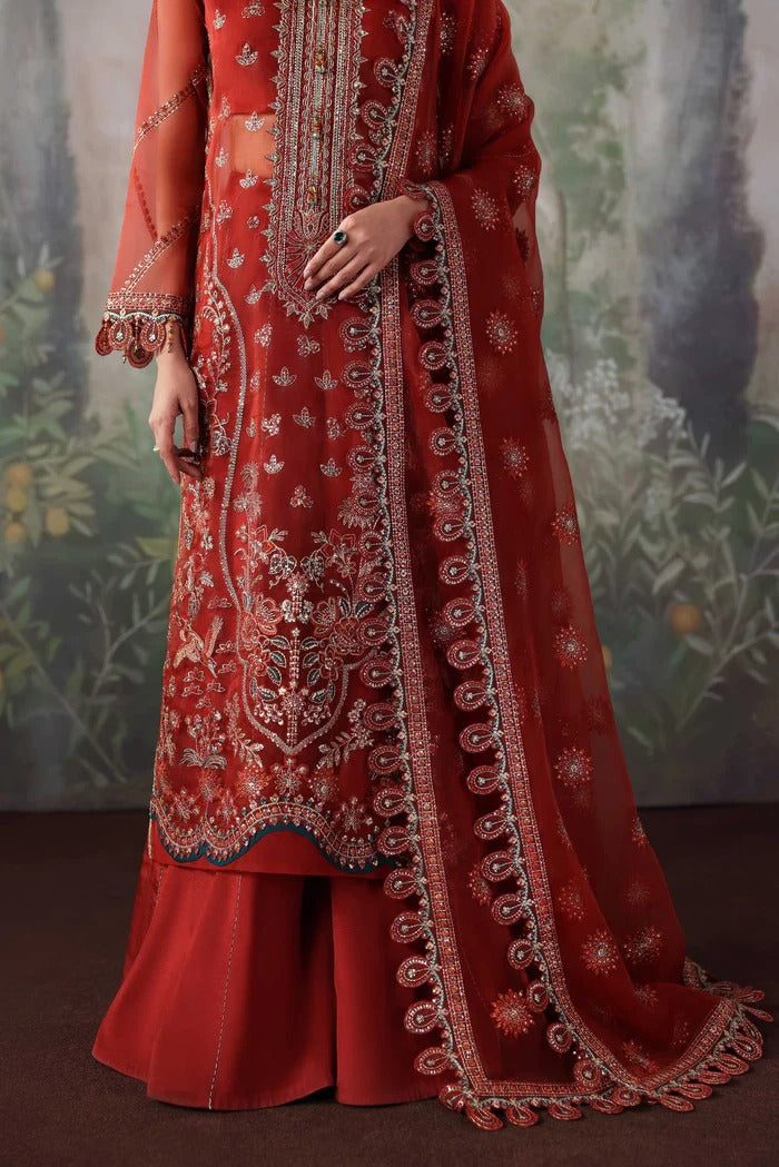 Stylish organza suit with embroidered front, neckline, back, sleeves & dupatta, paired with silk inner and trouser—crafted for elegance and grace.