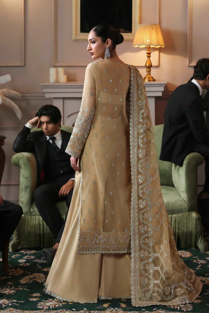 Elegant organza dress featuring embroidered panels, borders, sleeves & dupatta, paired with silk inner and trouser—crafted for timeless luxury style.